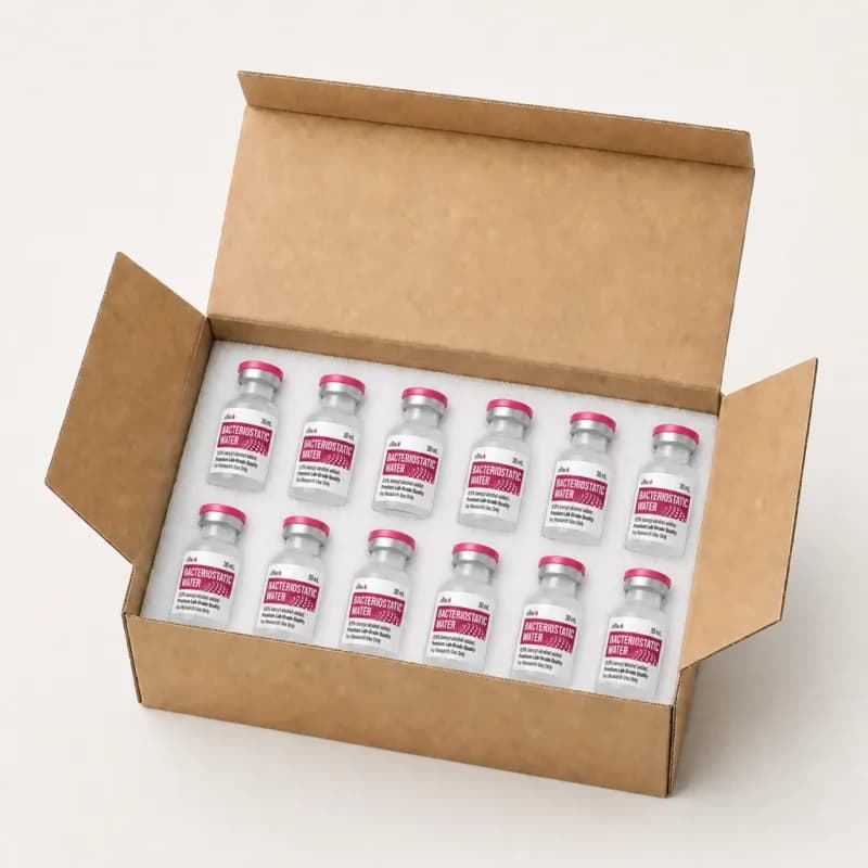 Vials nested in protective foam inside a plain cardboard shipping box